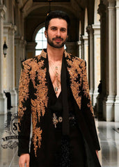 The intricate golden hand embroidery adds a touch of luxury and sophistication, making this a true Sherwani that will last a lifetime. Effortlessly sleek, perfectly tailored velvet Sherwani in Kokushoku Black— men’s cocktail fits designed for evenings that matter.