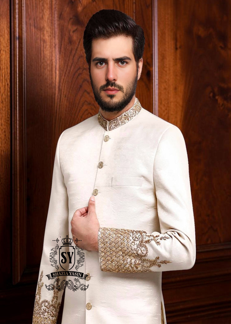 An off-white sherwani design imbued with artistic spirit, every detail meticulously crafted to celebrate the elegant beauty of the groom. The combined with delicate buttons running down the center, creating a focal point that is both classic and modern.
