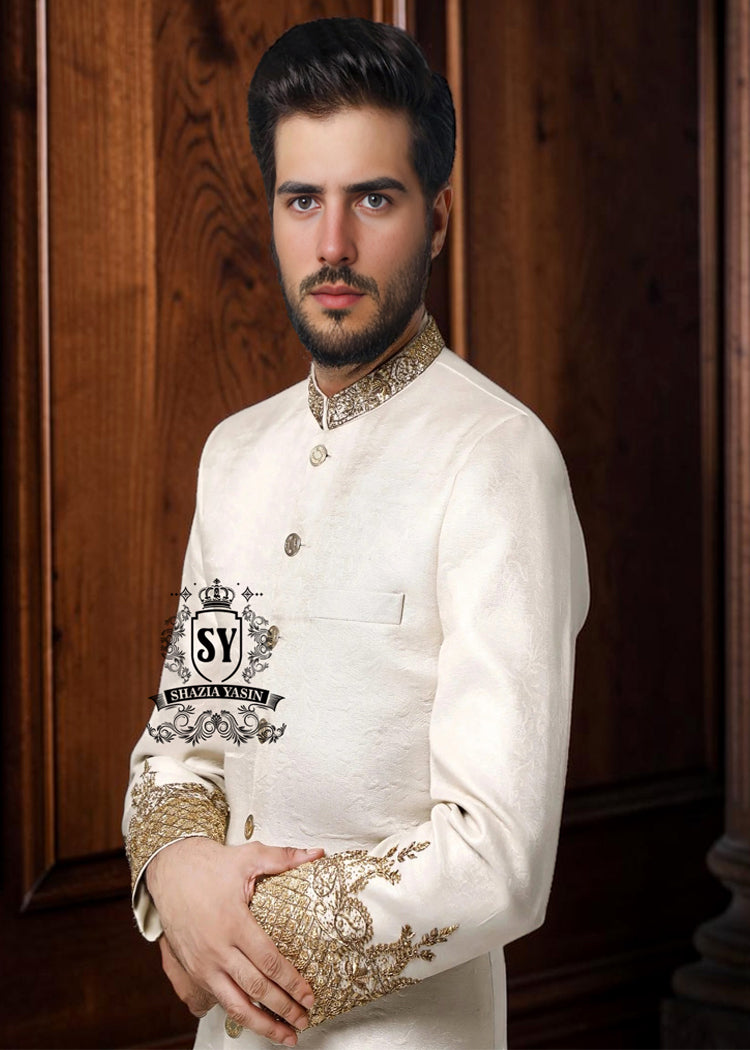 An off-white sherwani design imbued with artistic spirit, every detail meticulously crafted to celebrate the elegant beauty of the groom. The combined with delicate buttons running down the center, creating a focal point that is both classic and modern.