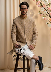 The signature elegance of the modern groom. A Sherwani suit that combines style, tradition, and premium tailoring. This elegant Bright Wood Sherwani dress blends timeless elegance with exquisite artistry, featuring beautiful embroidery that speaks of tradition and modern luxury.