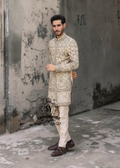 This Sherwani dress will charm everyone with its elegance and exquisiteness. The Blanched Almond color adds a touch of brightness, and beautiful jeweled work border on the front and along the hem creates a feeling of luxury and sophistication.