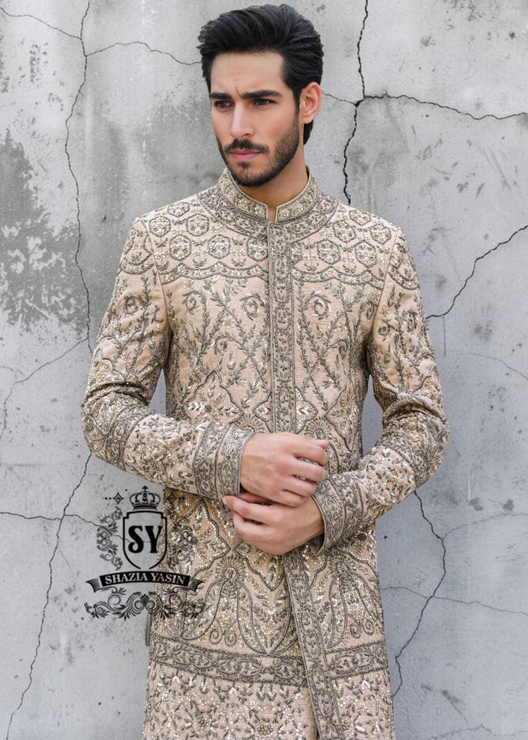 This Sherwani dress will charm everyone with its elegance and exquisiteness. The Blanched Almond color adds a touch of brightness, and beautiful jeweled work border on the front and along the hem creates a feeling of luxury and sophistication.