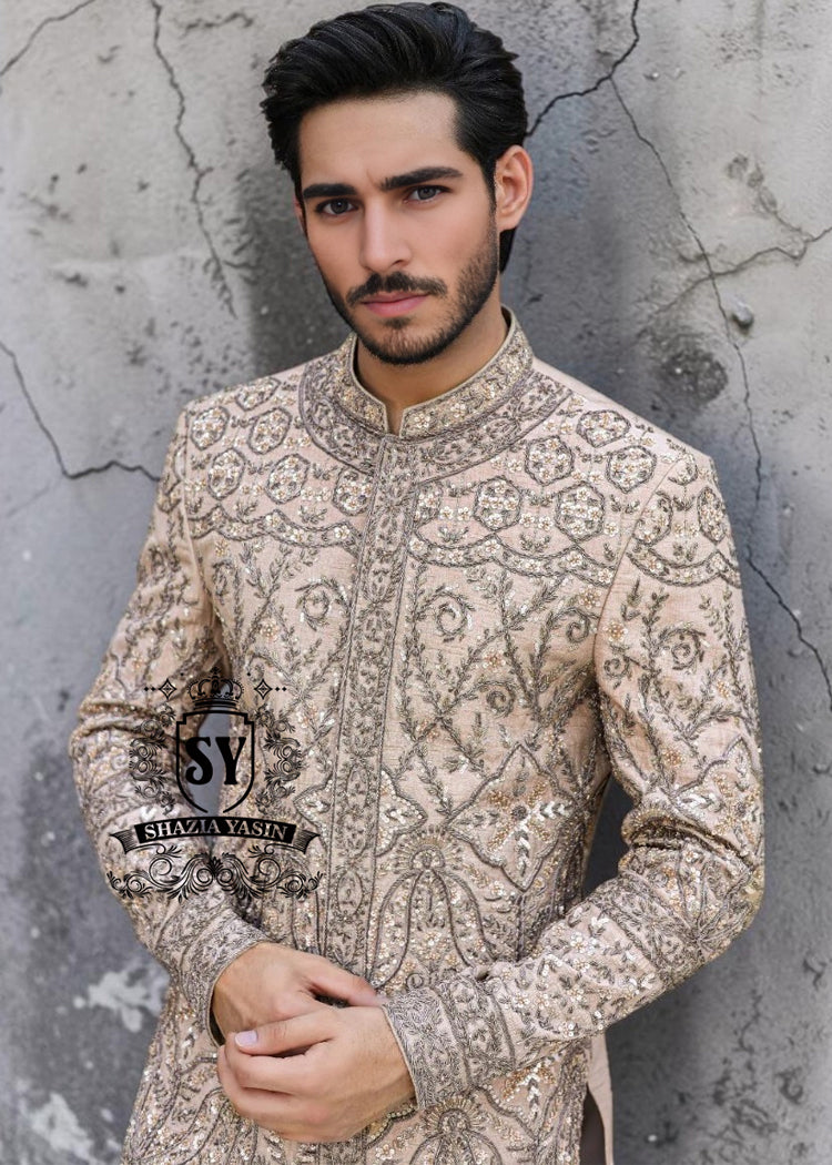 This Sherwani dress will charm everyone with its elegance and exquisiteness. The Blanched Almond color adds a touch of brightness, and beautiful jeweled work border on the front and along the hem creates a feeling of luxury and sophistication.