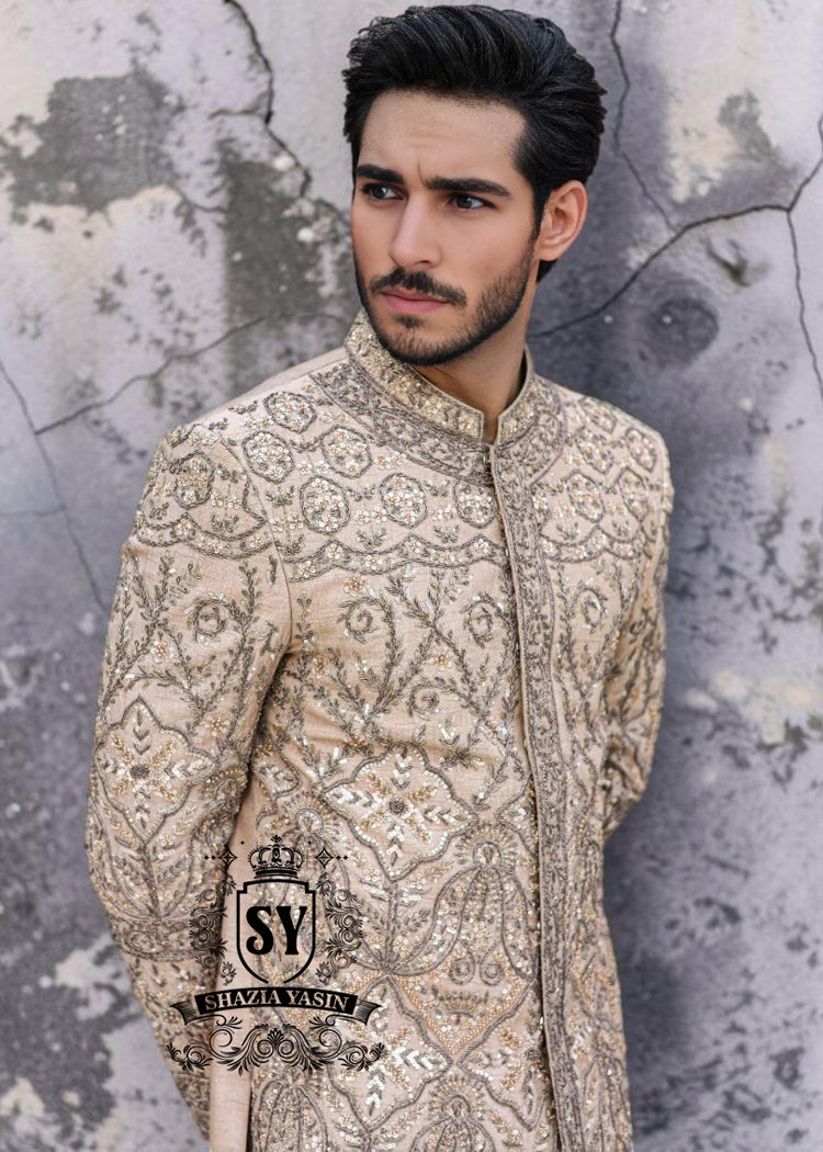 This Sherwani dress will charm everyone with its elegance and exquisiteness. The Blanched Almond color adds a touch of brightness, and beautiful jeweled work border on the front and along the hem creates a feeling of luxury and sophistication.