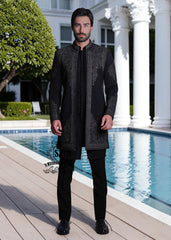 This front-open Sherwani suit boldly expresses a modern style, designed for the man who wants to exude presence without excessive ornamentation. Crafted from high-quality jet-black Korean suit fabric, the exquisite hand embroidery.