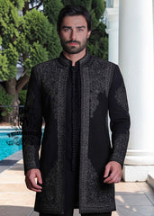 This front-open Sherwani suit boldly expresses a modern style, designed for the man who wants to exude presence without excessive ornamentation. Crafted from high-quality jet-black Korean suit fabric, the exquisite hand embroidery.