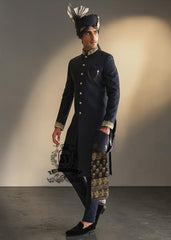 Indulge in a blissful moment with the beautiful Jets Navy Embellished Sherwani For Wedding, crafted from high-quality Jamawaar fabric. Perfect for any wedding occasion, this sherwani will make you shine on your special day.