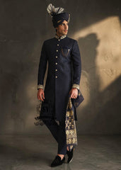 Indulge in a blissful moment with the beautiful Jets Navy Embellished Sherwani For Wedding, crafted from high-quality Jamawaar fabric. Perfect for any wedding occasion, this sherwani will make you shine on your special day.