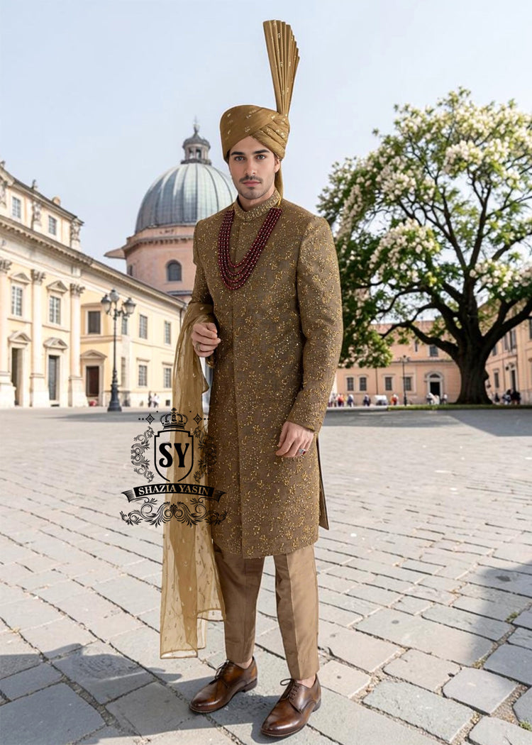 For the noble groom, a sophisticated and sharp Quartz Ochre sherwani, crafted from luxurious masoori net and adorned with exquisite jewels and timeless Zari embroidered floral motifs, was layered over a Quartz Ochre colored kurta set.