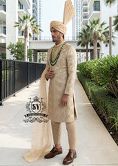 In the grandeur of royal legacy, this Taupe Gold sherwani stands as a tribute to timeless nobility. Handcrafted with intricate embroidery that echo strength and majesty, it glimmers with the delicate artistry of sequins, Swarovski crystals. A creation where tradition meets elegance - designed for the groom who carries the spirit of heritage with the poise of modern royalty.