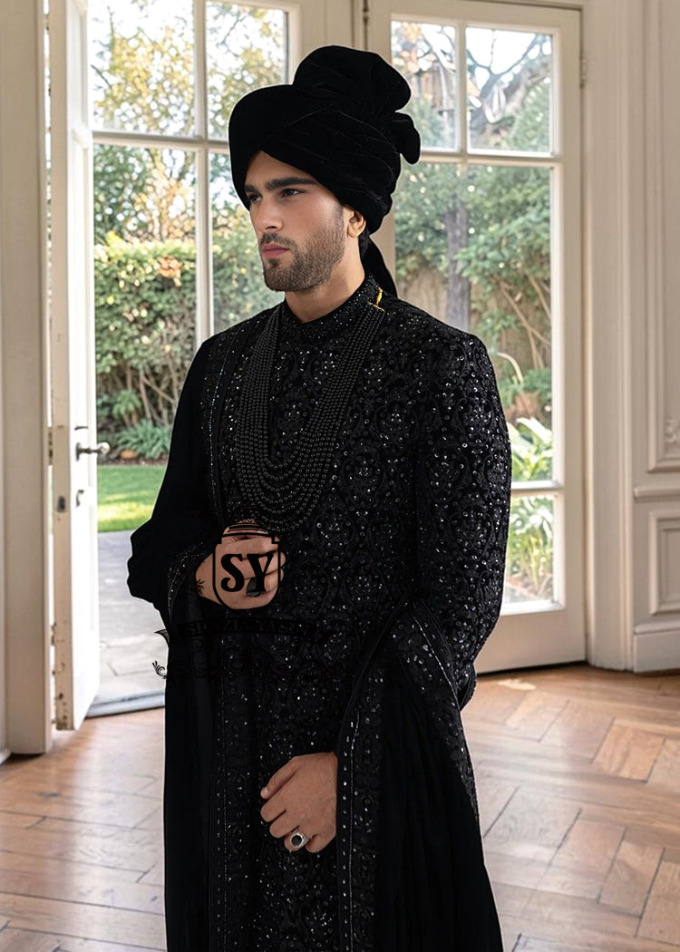  The Full Hand-Embroidered Black Sherwani is a masterpiece of couture, created for the groom who wishes to embody elegance, power, and tradition. Hand embroidery adorns the sherwani in lavish detail, transforming it into a regal statement piece. 