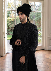  The Full Hand-Embroidered Black Sherwani is a masterpiece of couture, created for the groom who wishes to embody elegance, power, and tradition. Hand embroidery adorns the sherwani in lavish detail, transforming it into a regal statement piece. 