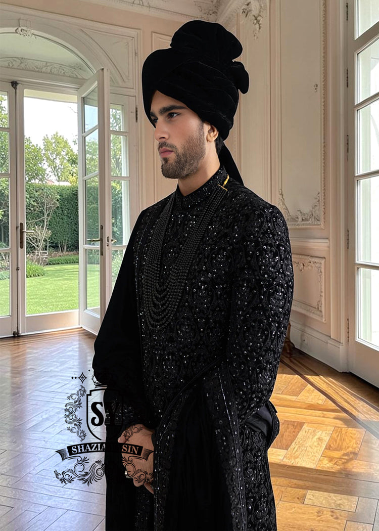  The Full Hand-Embroidered Black Sherwani is a masterpiece of couture, created for the groom who wishes to embody elegance, power, and tradition. Hand embroidery adorns the sherwani in lavish detail, transforming it into a regal statement piece. 