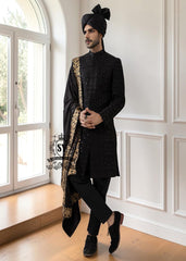 This men's wedding Sherwani is the perfect choice for the groom who wants a refined, modern, and impeccable look on his most important day. The tailored black Sherwani suit elegantly accentuates his figure, while the classic  shawl adds a unique and sophisticated touch.