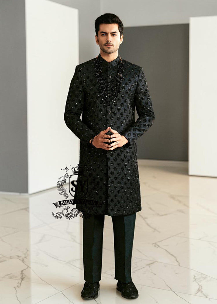 Black Embroidered Sherwani dignified and sophisticated design, this sherwani in deep black exudes power and elegance. Crafted from premium fabric, intricate embroidery that adds a touch of regal artistry without overpowering its sleek silhouette. The refined tailoring make it an ideal choice for grooms, formal receptions, and grand celebrations.