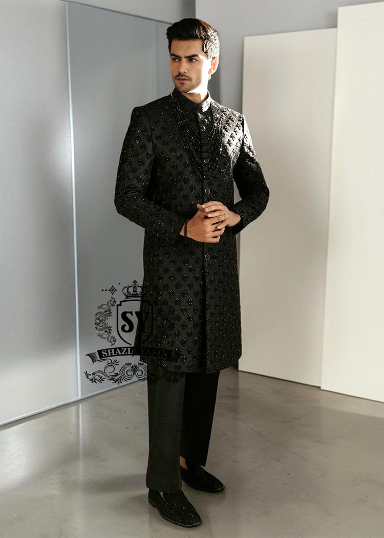 Black Embroidered Sherwani dignified and sophisticated design, this sherwani in deep black exudes power and elegance. Crafted from premium fabric, intricate embroidery that adds a touch of regal artistry without overpowering its sleek silhouette. The refined tailoring make it an ideal choice for grooms, formal receptions, and grand celebrations.