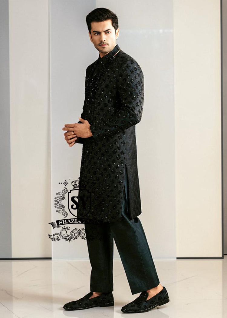 Black Embroidered Sherwani dignified and sophisticated design, this sherwani in deep black exudes power and elegance. Crafted from premium fabric, intricate embroidery that adds a touch of regal artistry without overpowering its sleek silhouette. The refined tailoring make it an ideal choice for grooms, formal receptions, and grand celebrations.