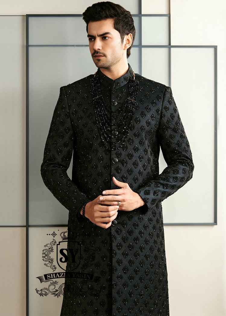 Black Embroidered Sherwani dignified and sophisticated design, this sherwani in deep black exudes power and elegance. Crafted from premium fabric, intricate embroidery that adds a touch of regal artistry without overpowering its sleek silhouette. The refined tailoring make it an ideal choice for grooms, formal receptions, and grand celebrations.