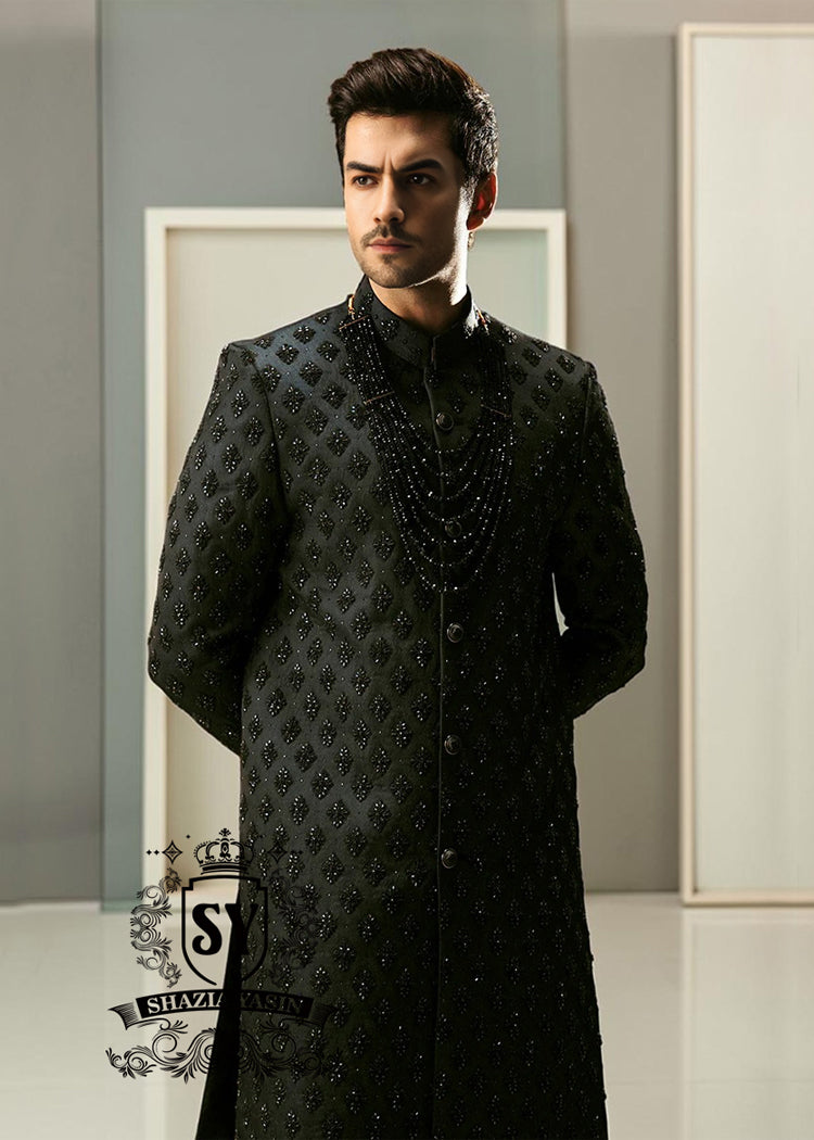 Black Embroidered Sherwani dignified and sophisticated design, this sherwani in deep black exudes power and elegance. Crafted from premium fabric, intricate embroidery that adds a touch of regal artistry without overpowering its sleek silhouette. The refined tailoring make it an ideal choice for grooms, formal receptions, and grand celebrations.