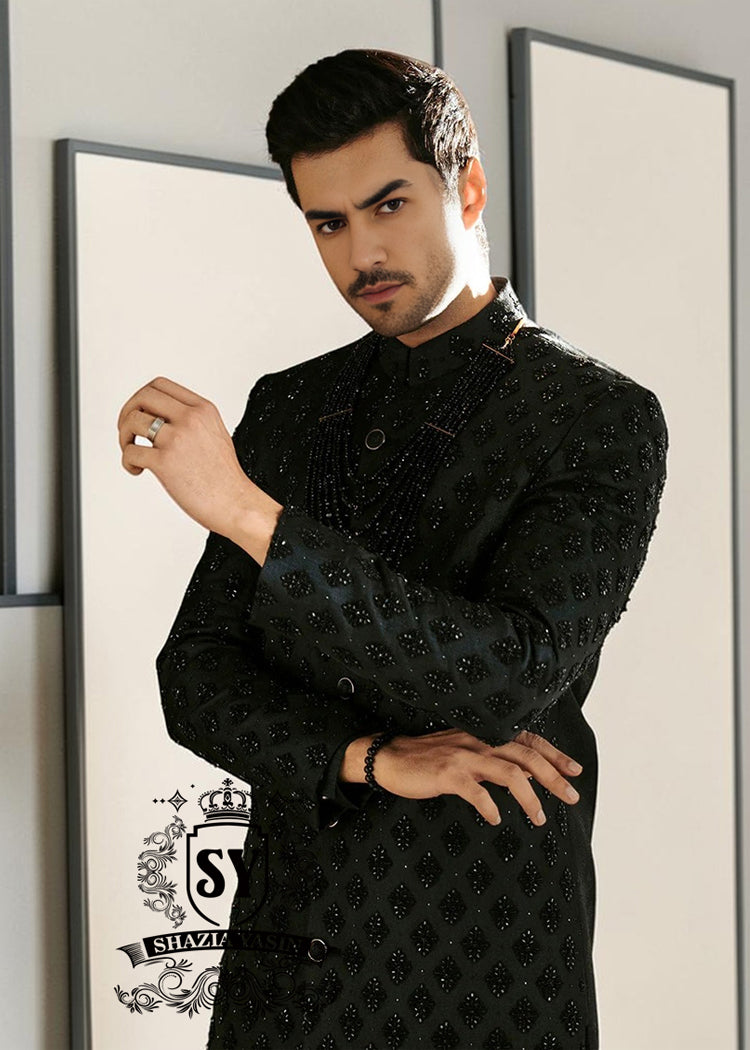 Black Embroidered Sherwani dignified and sophisticated design, this sherwani in deep black exudes power and elegance. Crafted from premium fabric, intricate embroidery that adds a touch of regal artistry without overpowering its sleek silhouette. The refined tailoring make it an ideal choice for grooms, formal receptions, and grand celebrations.