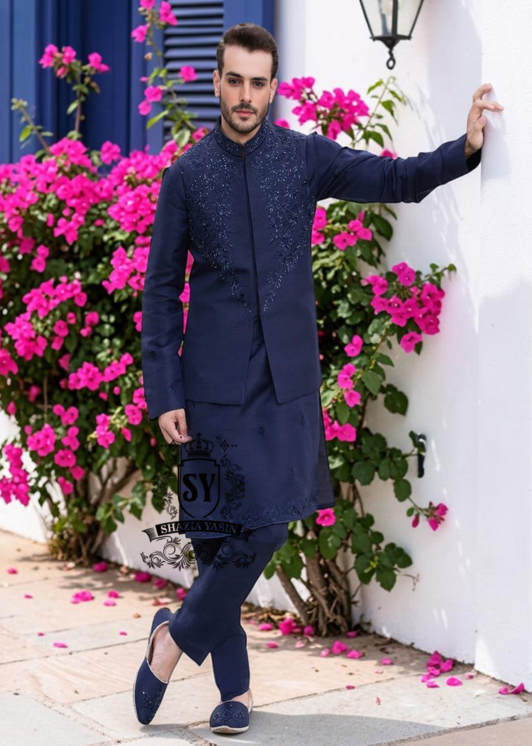 A stylish waistcoat crafted from luxurious navy blue raw silk fabric. The waistcoat itself, the front, and the sleeves are adorned with intricate threadwork and embroidery, giving it a refined and traditional feel.