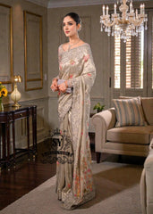 Designer Couture Saree Wedding dress with an open Back Blouse adorned with 3D flowers and a soft pleated Saree