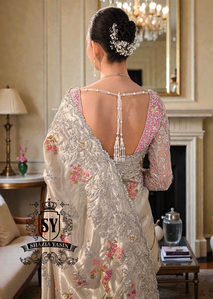 Designer Couture Saree Wedding dress with an open Back Blouse adorned with 3D flowers and a soft pleated Saree